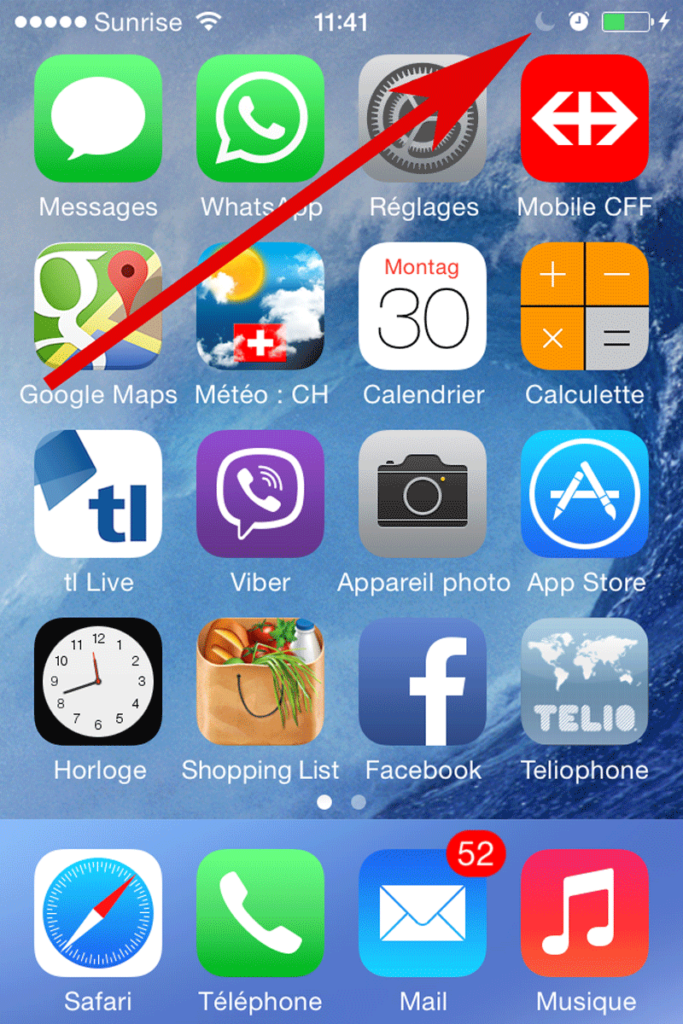 A crescent moon icon on an iPhone indicates that the Do Not Disturb feature is enabled
